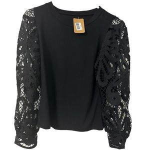 NWT Boutique black long sleeve blouse with intricate detailed sleeve pattern!!!